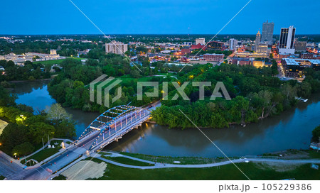 Martin Luther King Bridge leading to Headwaters Park and downtown Fort Wayne night lights aerial 105229386