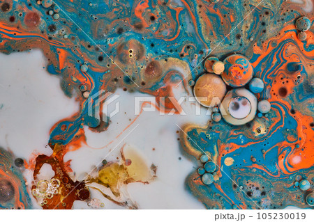 Marble like painting in abstract background asset with oil spheres of swirling blue gold white and orange Marble like painting in abstract background asset with oil spheres of swirling blue gold white and orange 105230019