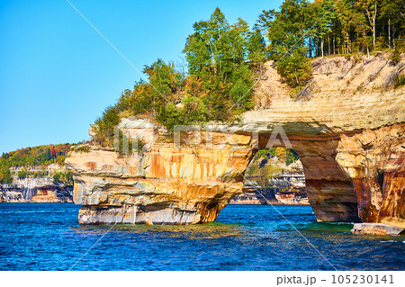 Sapphire waters in Lake Michigan with cliff archway at Pictured Rocks National Park Sapphire waters in Lake Michigan with cliff archway at Pictured Rocks National Park 105230141