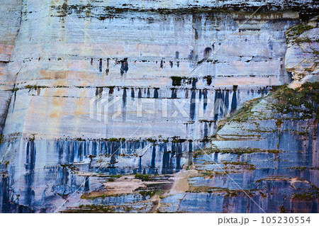 Background Pictured Rocks with minerals dripping like paint down stone cliff face Background Pictured Rocks with minerals dripping like paint down stone cliff face 105230554