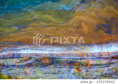 Pictured Rocks National Park with crashing waves and clear water revealing submerged cliffs Pictured Rocks National Park with crashing waves and clear water revealing submerged cliffs 105230682