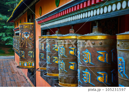 Large ornate prayer wheels at Tibetan Mongolian Buddhist shrine 105231597
