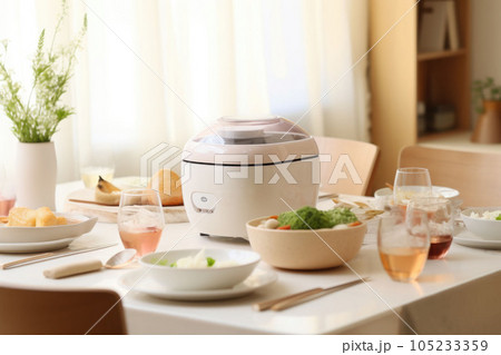 A minimalist bright kitchen with a rice cooker and dishes on top of the dining table. Generative AI 105233359