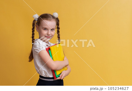 Cute funny schoolgirl getting ready to go back to school. High quality photo Cute funny schoolgirl getting ready to go back to school. High quality photo 105234627