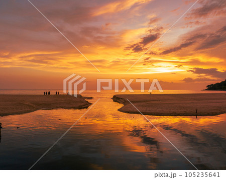 .aerial view stunning reflection of bright golden sky in a canal at Karon beach Phuket. 105235641