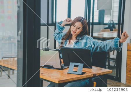 Female programmers are stretching oneself and relaxing after working and planning to work on programming, software coding and web design. Concept technology development. 105235908