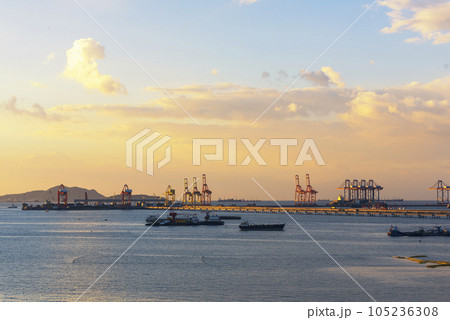 Engineering shipping crane depot at logistic export terminal control. Warehouse freight background container yard loading quayside harbor port. Logistics seascape shipping portal concept 105236308