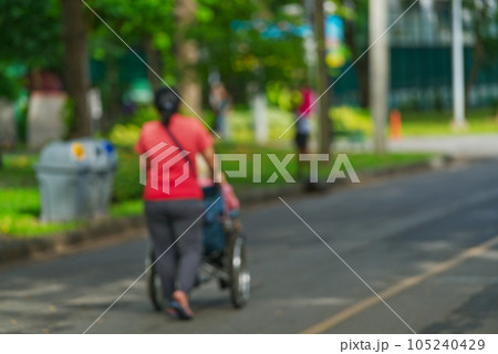 Back side of a senior person in a wheelchair 105240429