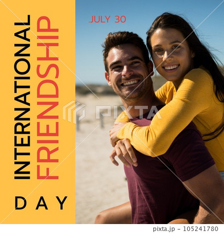 International friendship day text with happy caucasian male and female friend piggybacking on beach 105241780