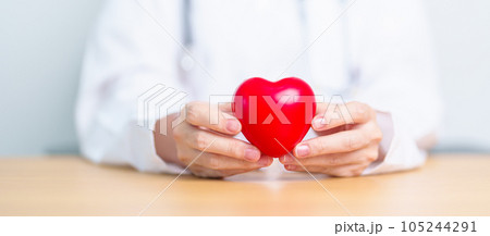 Doctor hand holding red heart shape in hospital. love, donor, world heart day, world health day, CSR donation and Insurance concepts 105244291
