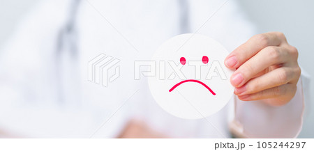 Doctor show Unhappy sad face paper, Mental health Assessment, Psychology, Health Wellness, Negative Feedback, Customer Review, Bad Experience, Satisfaction Survey, World Mental Health day concept 105244297