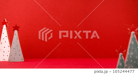 Christmas tree on red backgound,copy space banner invitation for holiday Christmas tree on red backgound,copy space banner invitation for holiday 105244477
