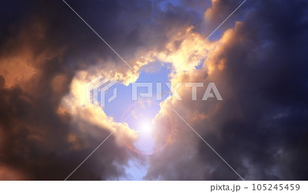 Heart in cloud. Heart shaped hole in stormy sky.  Valentine background with copy space for text 105245459