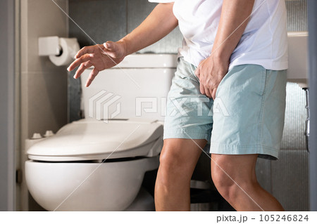 Sick asian middle aged man suffering from dysuria,acute cystitis and smelly urine from urinary tract infection,people patient holding crotch in toilet,prostate problems,painful or difficult urination Sick asian middle aged man suffering from dysuria,acute cystitis and smelly urine from urinary tract infection,people patient holding crotch in toilet,prostate problems,painful or difficult urination 105246824