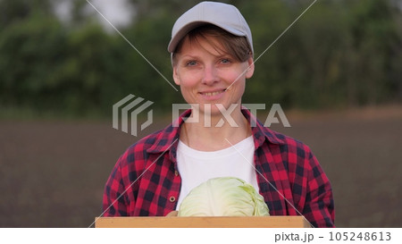 farmer portrait smile, agriculture, harvest box cabbage, vegetable season farming, farmer smiling field harvesting, soil girl products green agricultural plant technologies crop environmental woman 105248613
