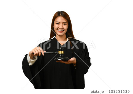 Portrait of judge dressed in robe gown uniform holding gavel hammer mallet isolated on white background Portrait of judge dressed in robe gown uniform holding gavel hammer mallet isolated on white background 105251539