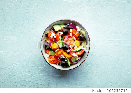 Greek salad. Fresh tomato, cucumber, bell pepper, Feta cheese, onion, and olives Greek salad. Fresh tomato, cucumber, bell pepper, Feta cheese, onion, and olives 105252715