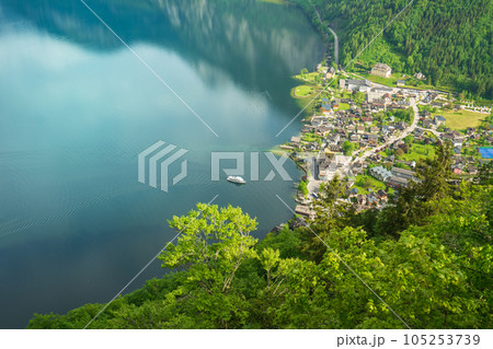 A Beautiful Lakeside View with Stunning Mountain Scenery and Historic Buildings. 105253739