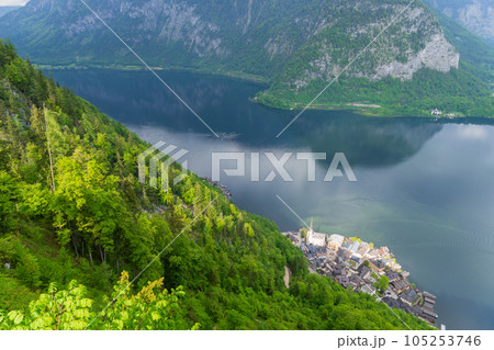 A Beautiful Lakeside View with Stunning Mountain Scenery and Historic Buildings. 105253746