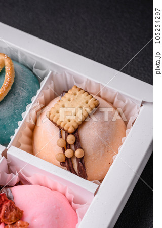 Delicious sweet colorful mochi desserts or ice cream with rice dough and toppings Delicious sweet colorful mochi desserts or ice cream with rice dough and toppings 105254297