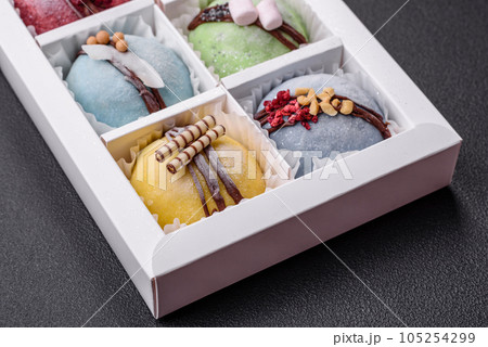 Delicious sweet colorful mochi desserts or ice cream with rice dough and toppings 105254299
