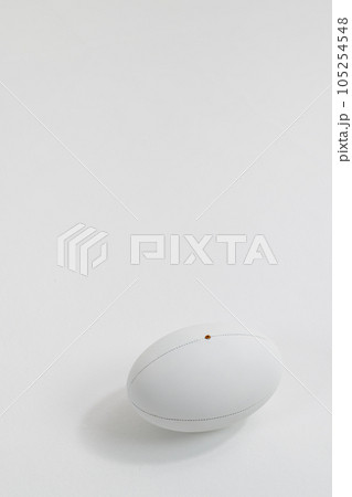 White rugby ball with copy space on white background 105254548