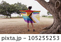 Woman with LGBT flag in the park on pride parade 105255253