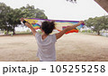Woman with LGBT flag in the park on pride parade 105255258