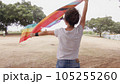Woman with LGBT flag in the park on pride parade 105255260