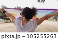 Woman with LGBT flag in the park on pride parade 105255263