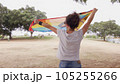 Woman with LGBT flag in the park on pride parade 105255266