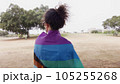 Woman with LGBT flag in the park on pride parade 105255268