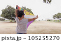 Woman with LGBT flag in the park on pride parade 105255270