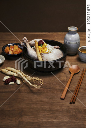 korean traditional food samgyetang, chicken soup with ginseng with korean traditional alcohol korean traditional food samgyetang, chicken soup with ginseng with korean traditional alcohol 105255676