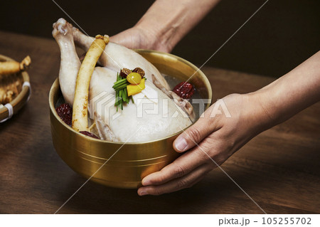 korean traditional food samgyetang, chicken soup with ginseng served korean traditional food samgyetang, chicken soup with ginseng served 105255702