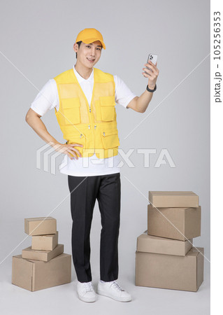 millennials and gen z, korean asian young man taking a picture with smartphone 105256353