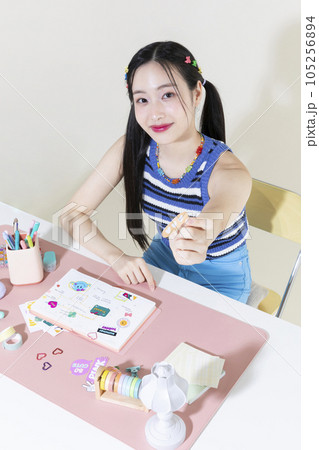 vintage y2k retro concept photo of korean asian cute woman decorating diary 105256894