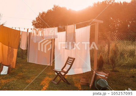 A place for drying linen, sheets and clothes on the street in the courtyard of a village house. The concept of autumn. 105257095