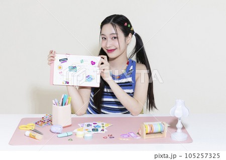 vintage y2k retro concept photo of korean asian cute woman with decorated diary 105257325