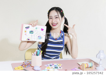vintage y2k retro concept photo of korean asian cute woman with decorated diary 105257342
