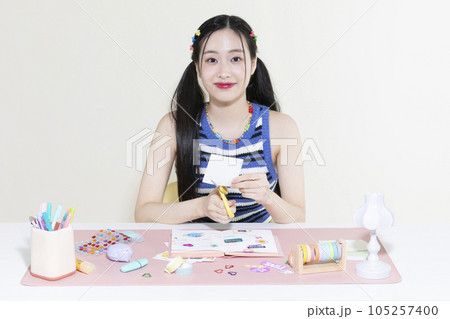 vintage y2k retro concept photo of korean asian cute woman decorating diary 105257400