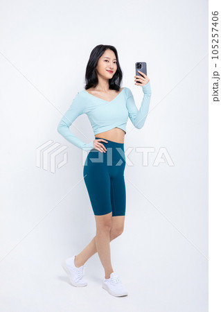 healthy beauty concept photo of korean asian beautiful woman with smartphone healthy beauty concept photo of korean asian beautiful woman with smartphone 105257406