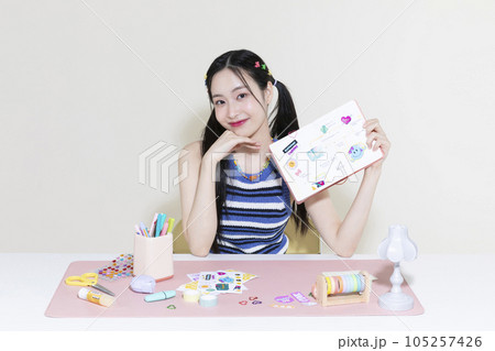 vintage y2k retro concept photo of korean asian cute woman with decorated diary 105257426