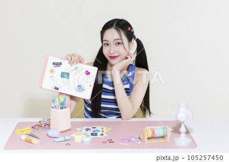 vintage y2k retro concept photo of korean asian cute woman with decorated diary 105257450