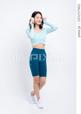 healthy beauty concept photo of korean asian beautiful woman wearing a headphones and listening to music healthy beauty concept photo of korean asian beautiful woman wearing a headphones and listening to music 105257462