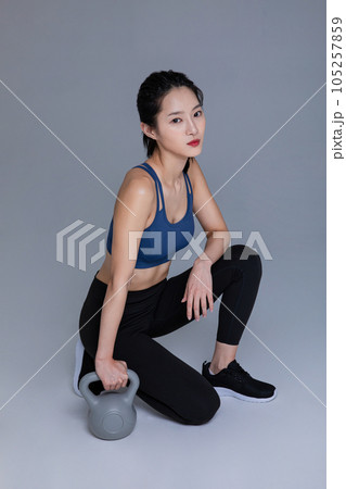 healthy beauty concept photo of korean asian beautiful woman with kettlebell healthy beauty concept photo of korean asian beautiful woman with kettlebell 105257859