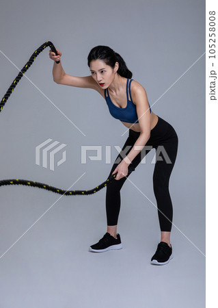 healthy beauty concept photo of korean asian beautiful woman with battling ropes healthy beauty concept photo of korean asian beautiful woman with battling ropes 105258008