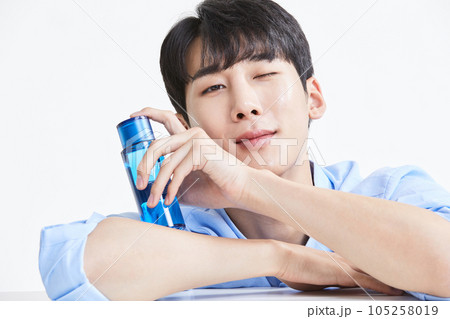 korean asian young man with skincare products 105258019