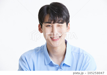 korean asian young man winking and smiling 105258047