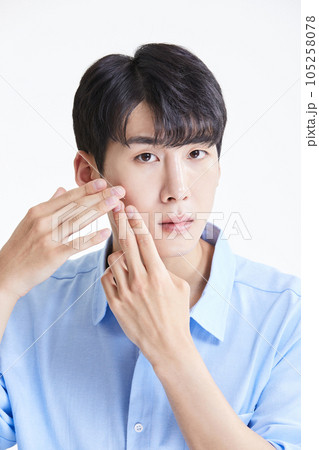 korean asian young man with skin concerns korean asian young man with skin concerns 105258078